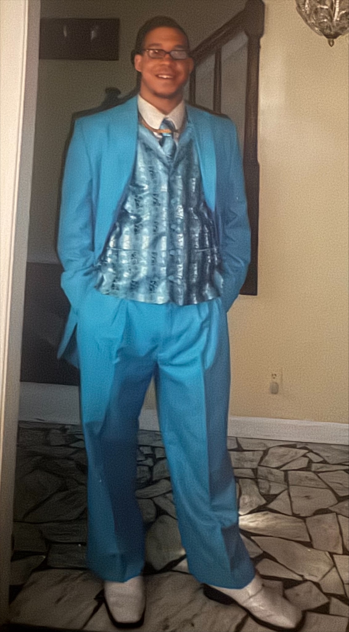 A family member dressed in brilliant blue formalwear