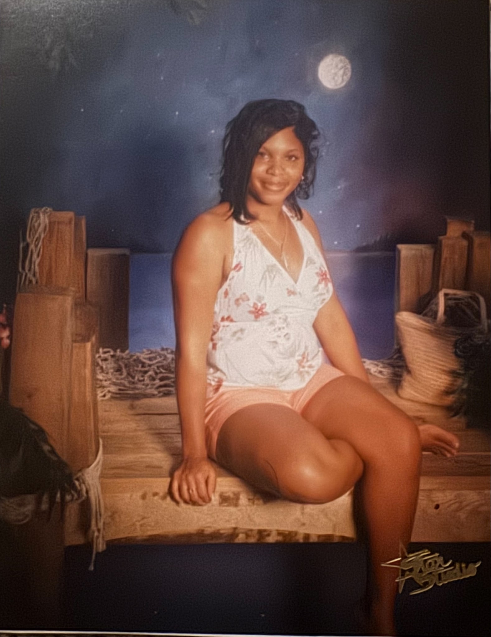 A young woman seated for a portrait