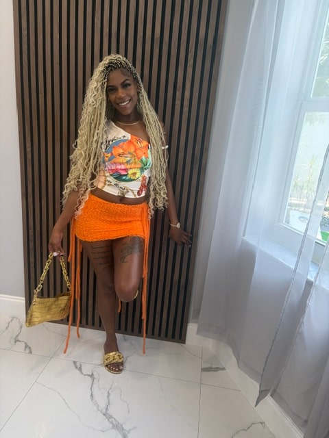 A family member smiling in a colorful outfit