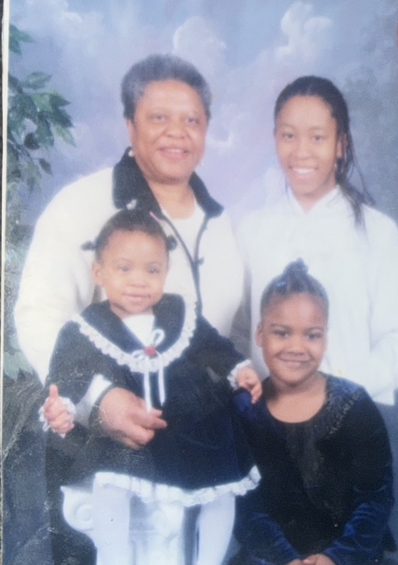 Mrs. Poe with three girls in a family portrait